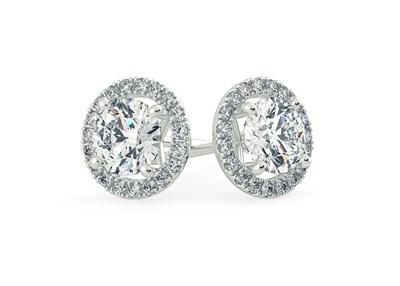A pair of round halo diamond stud earrings in platinum