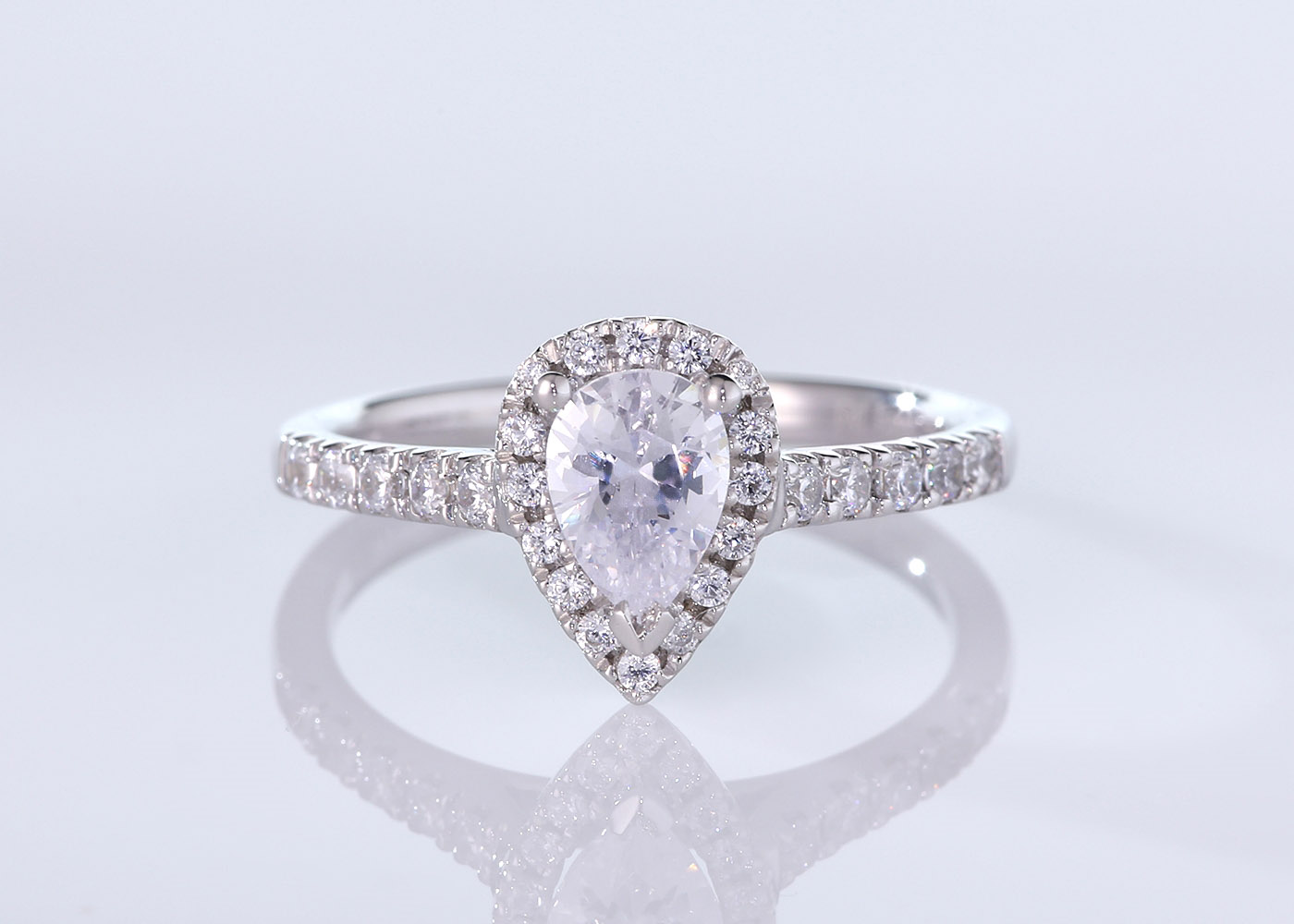 Half Carat Pear Halo Diamond Ring in 9K White Gold 360 image